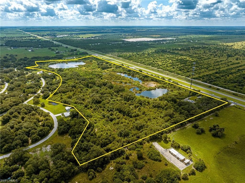 View of property location featuring property boundaries highlighted and a large body of water