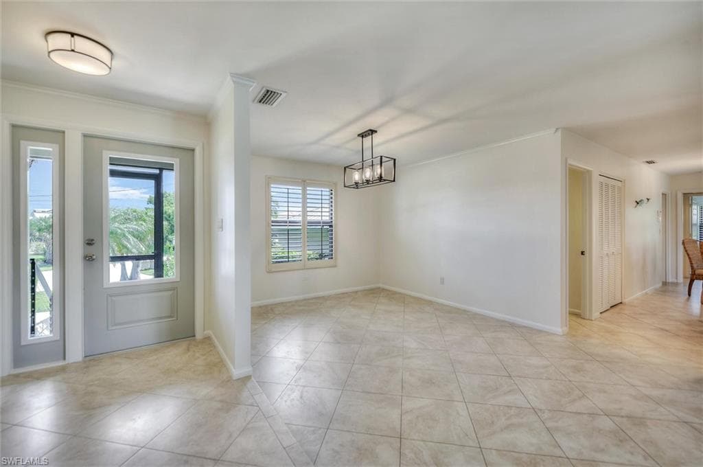 Bedroom with a ceiling fan and light tile patterned flooring