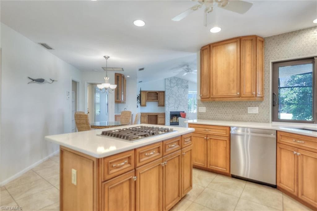 Laundry room featuring recessed lighting, light tile patterned flooring, independent washer and dryer, electric panel, and cabinet space