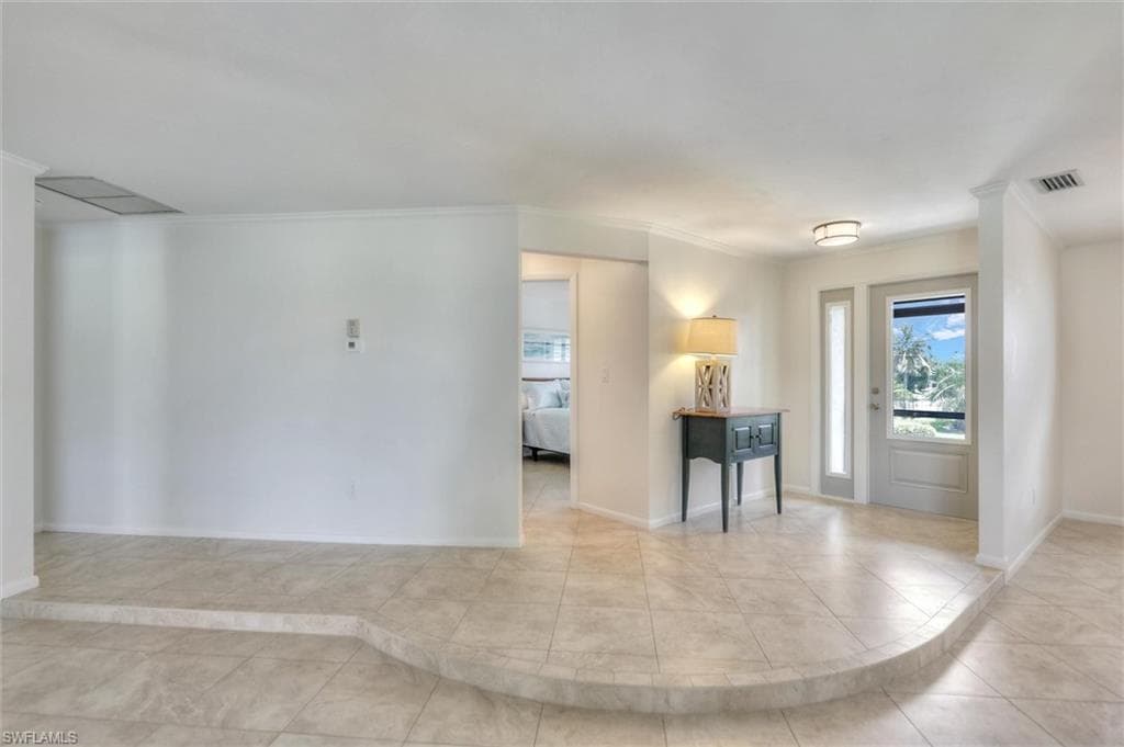 Bathroom with vanity, bath / shower combo with glass door, tile patterned floors, and recessed lighting