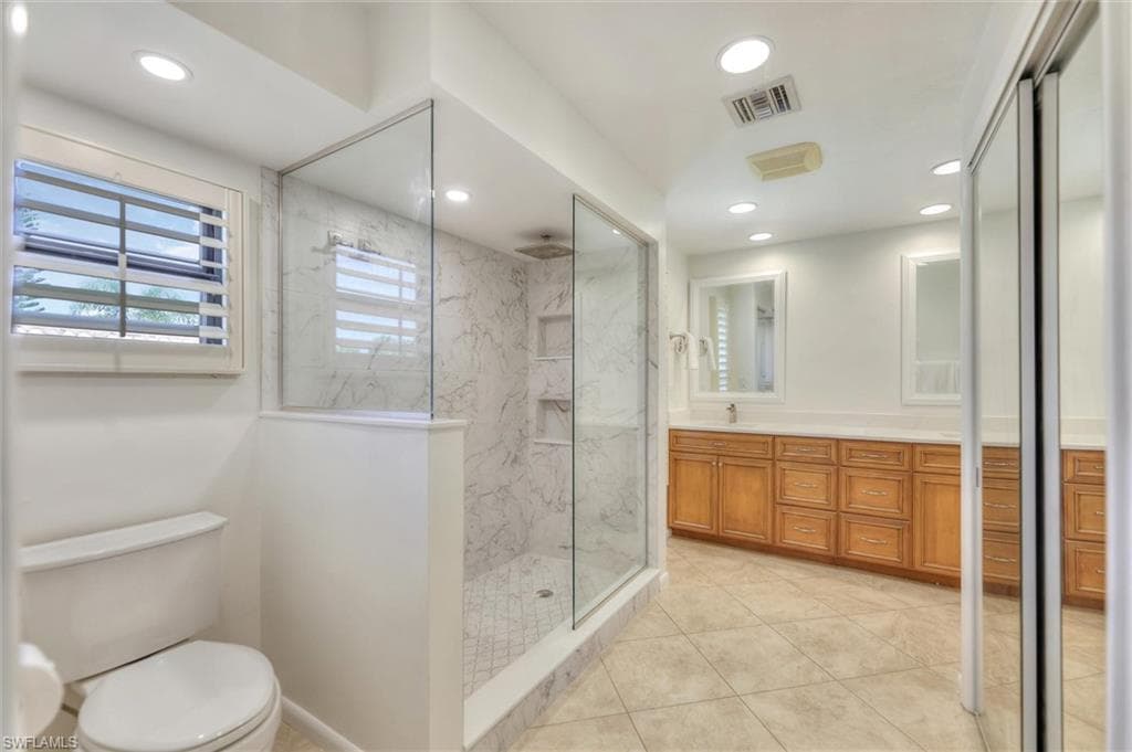 Bedroom with access to outside, ornamental molding, light tile patterned floors, ceiling fan, and a sunroom
