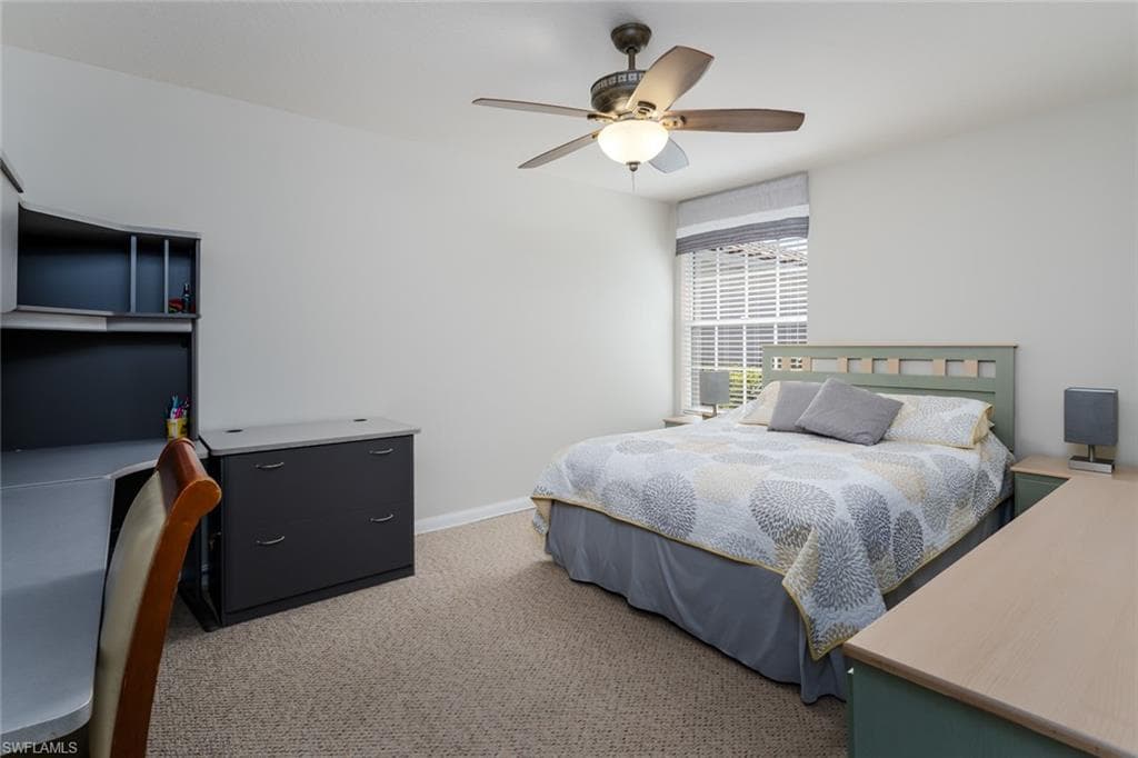 Bedroom featuring light carpet and ceiling fan