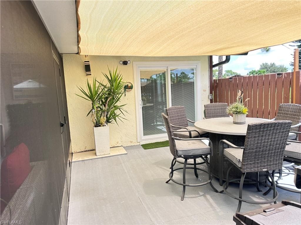 View of patio with outdoor dining space