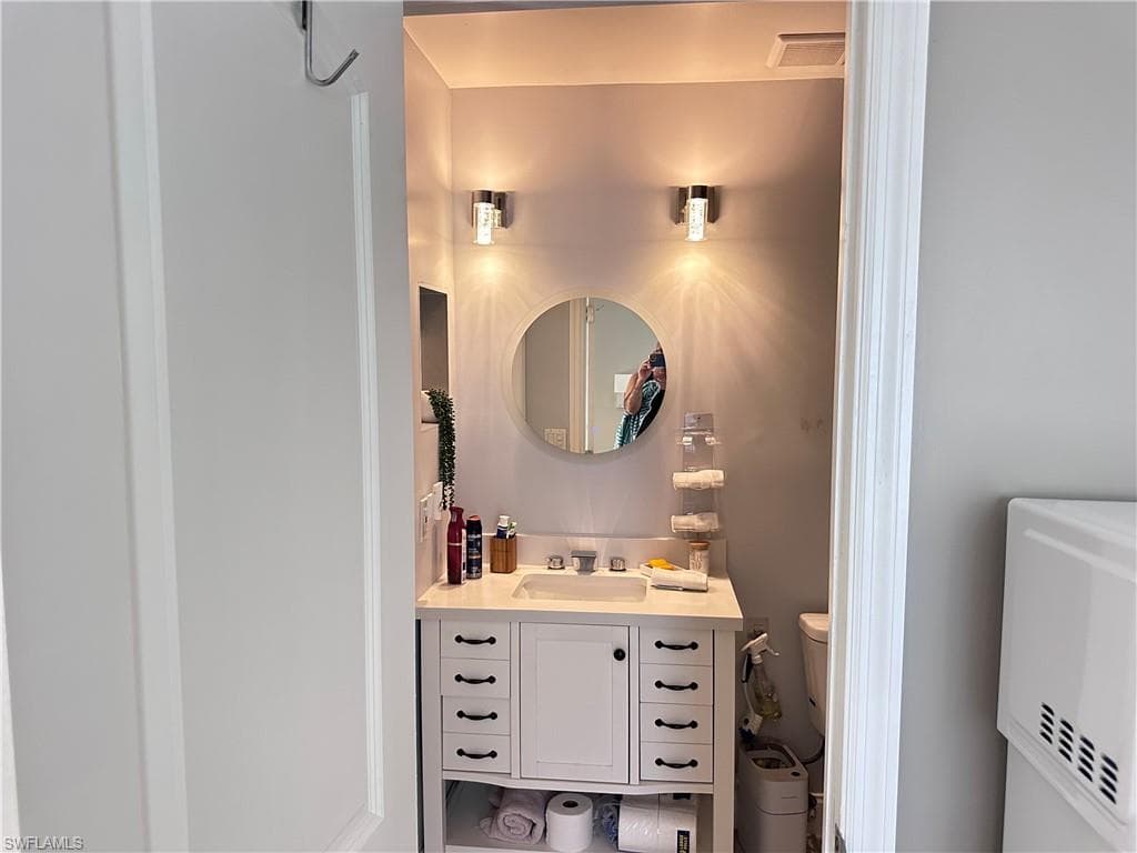 Bathroom featuring toilet and vanity