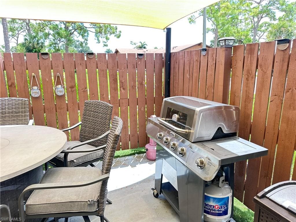 View of patio / terrace with grilling area and outdoor dining space