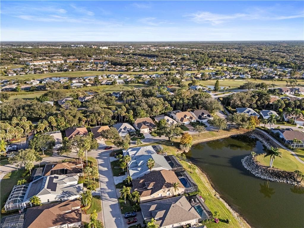 Aerial overview of property's location featuring nearby suburban area and a large body of water