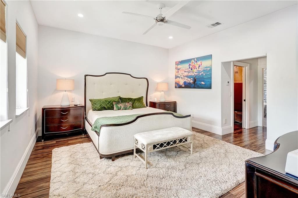 Bedroom featuring dark wood finished floors, recessed lighting, and a ceiling fan