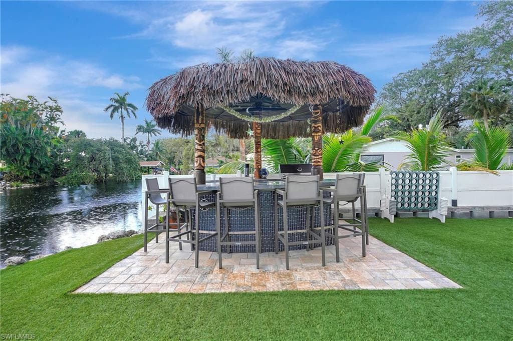 View of yard featuring a patio and a water view