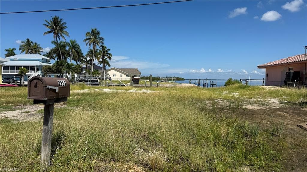 View of yard with a water view