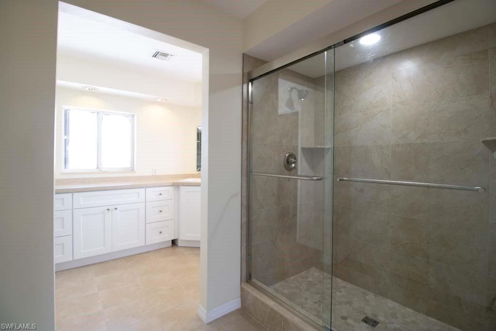 Spare room featuring french doors, dark wood finished floors, ornamental molding, and a ceiling fan