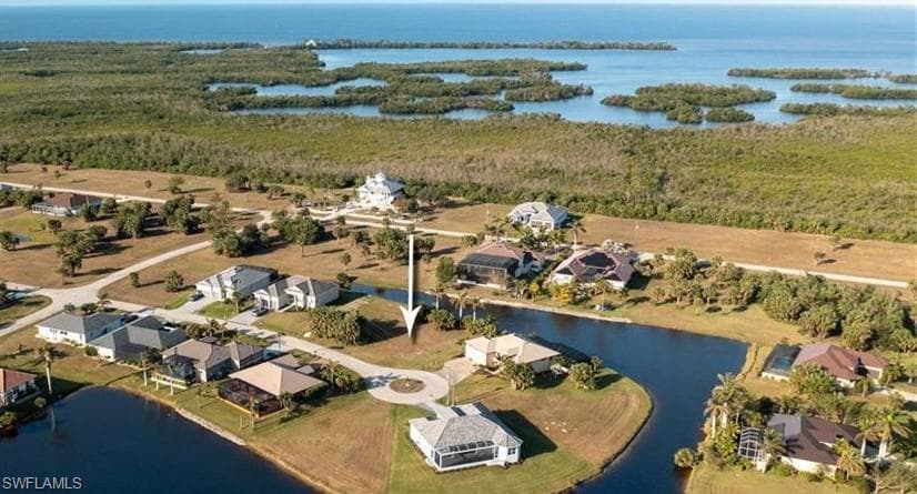 Aerial view of residential area with a nearby body of water