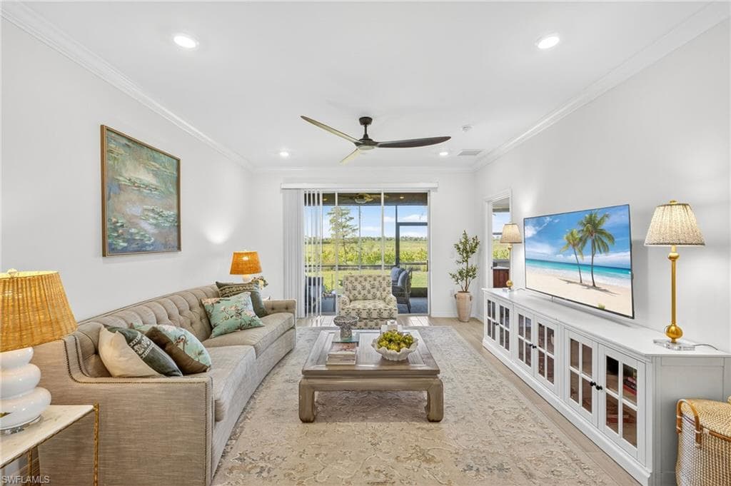 Living area featuring ornamental molding, ceiling fan, wood finished floors, and recessed lighting
