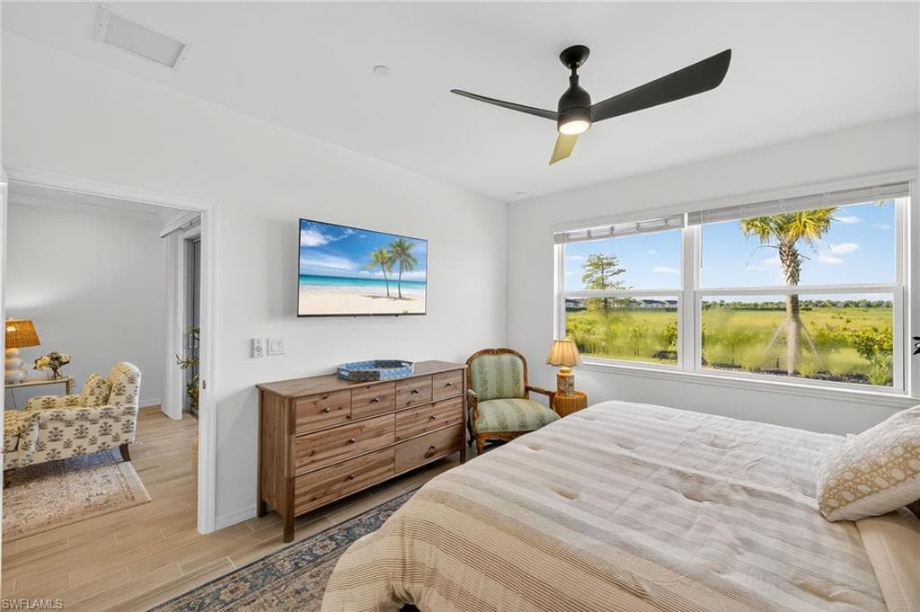 Bedroom featuring light wood-style flooring and a ceiling fan