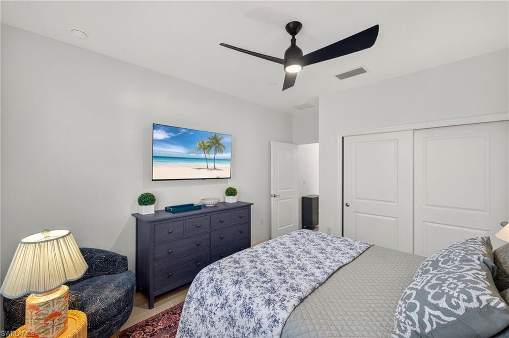 Bedroom with a closet and ceiling fan