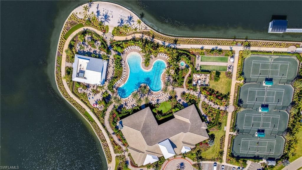 Aerial overview of property's location featuring a pool area and a large body of water
