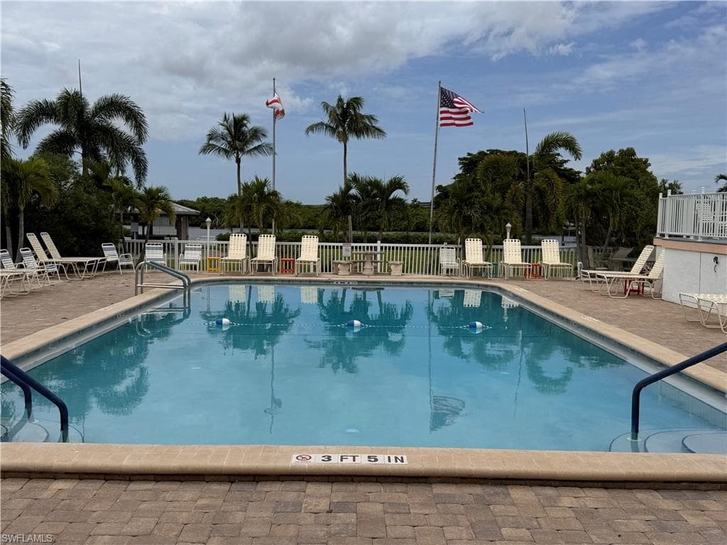 Community pool featuring a patio area