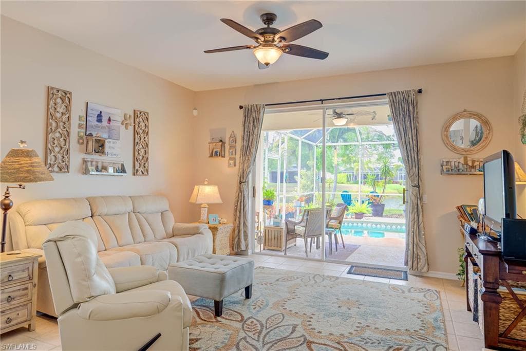Bright family room opens to pool and lake view!
