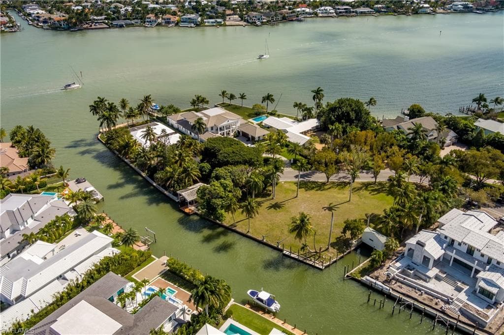 Aerial view of residential area with a large body of water