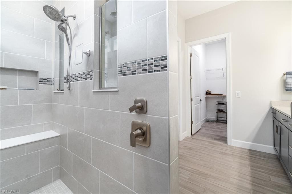 Large walk-in shower with spa like features.