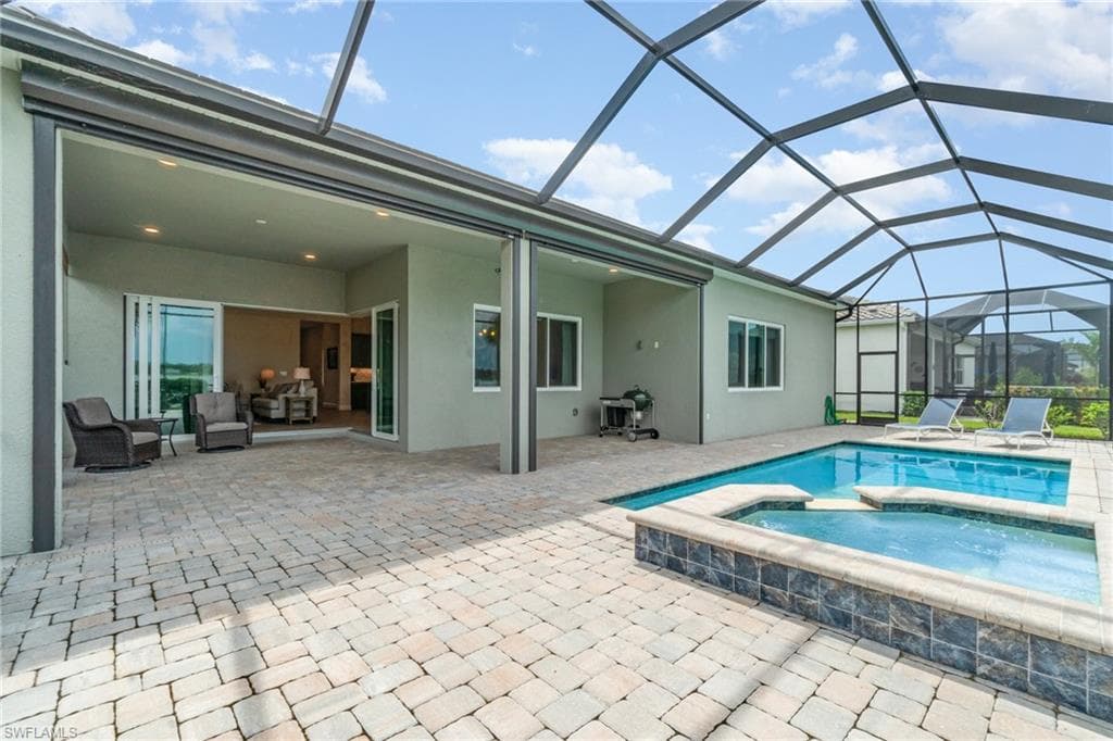 Pool/Spa with large entertainment area and covered lanai.