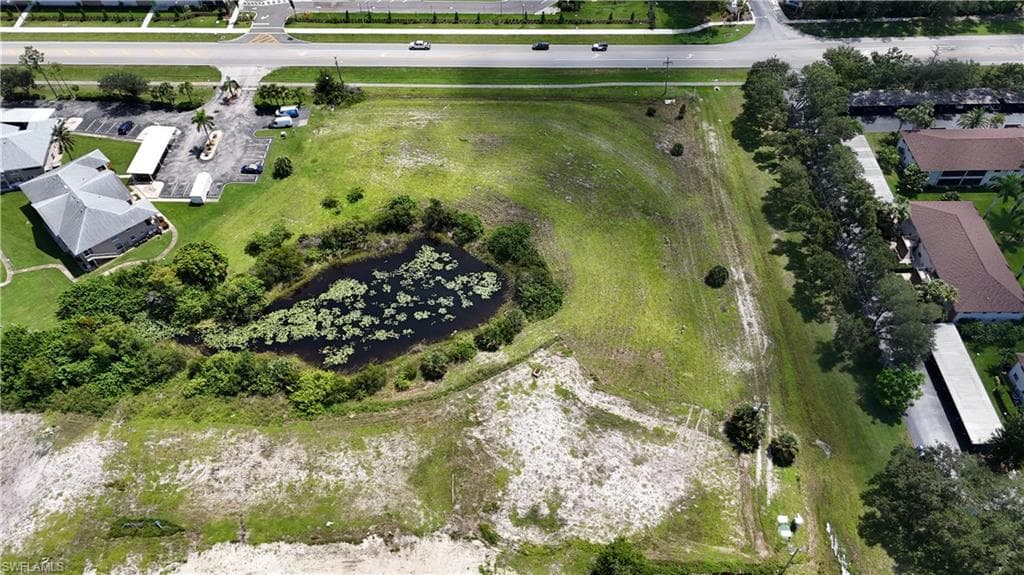 Aerial view of property's location featuring a large body of water