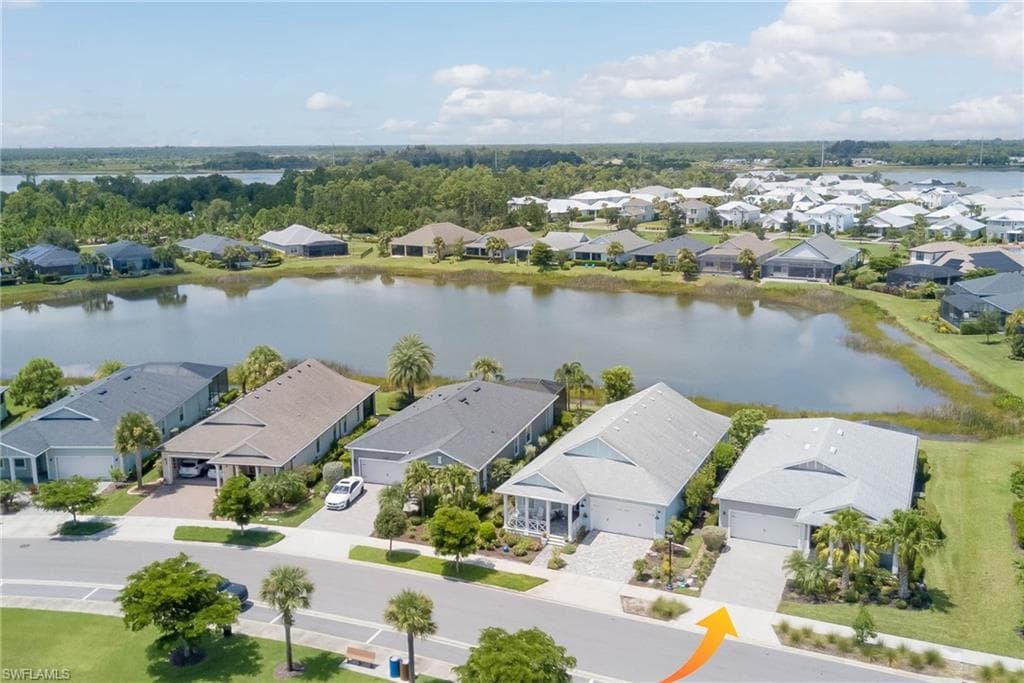 Aerial perspective of suburban area with a large body of water
