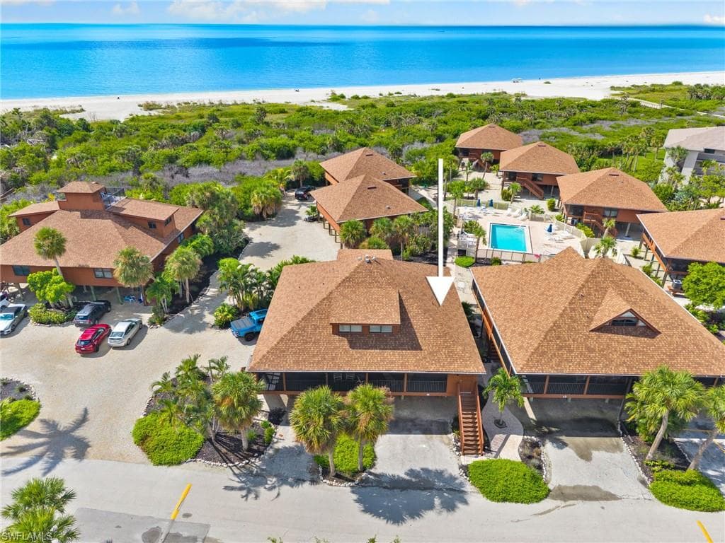 Aerial view of a pool area and extended coastline