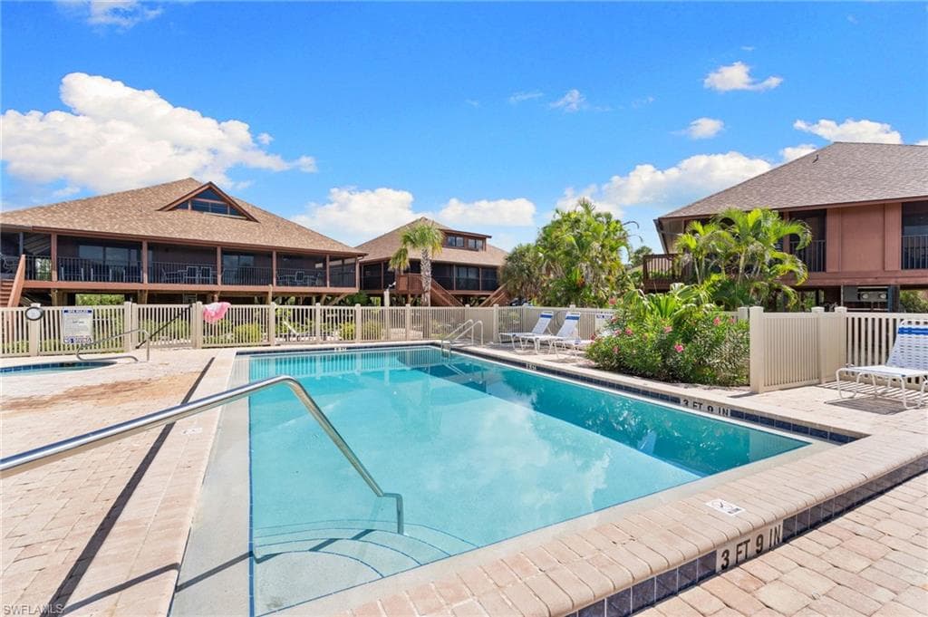 Community pool featuring a patio area