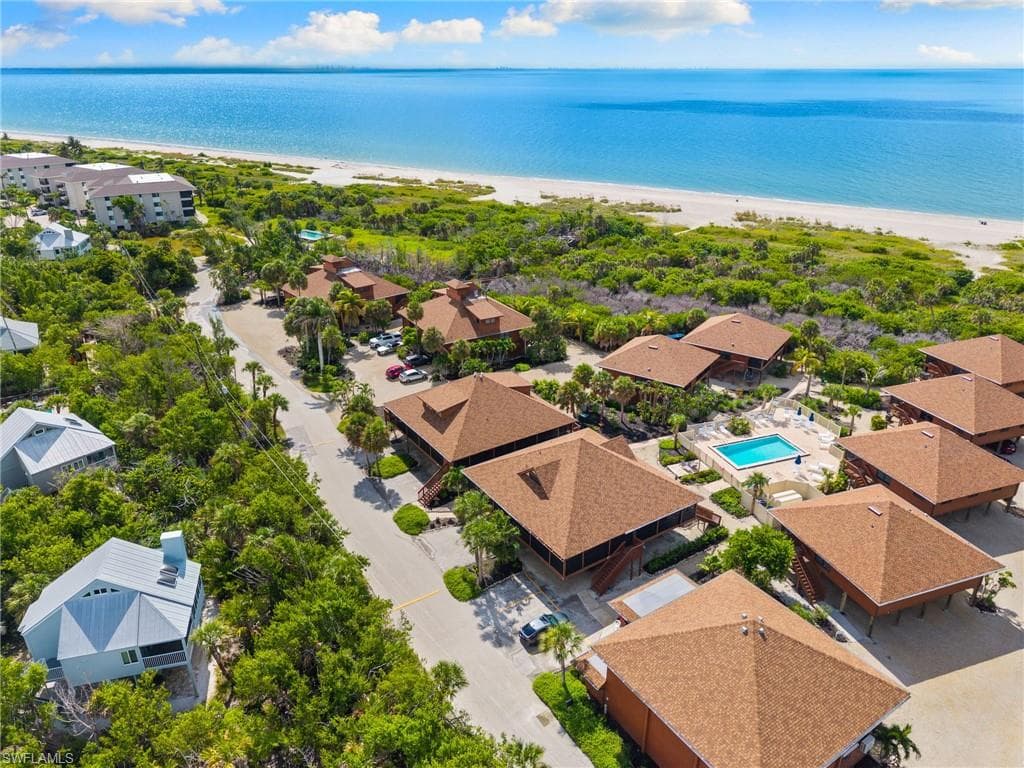 Aerial perspective of suburban area featuring unending shoreline