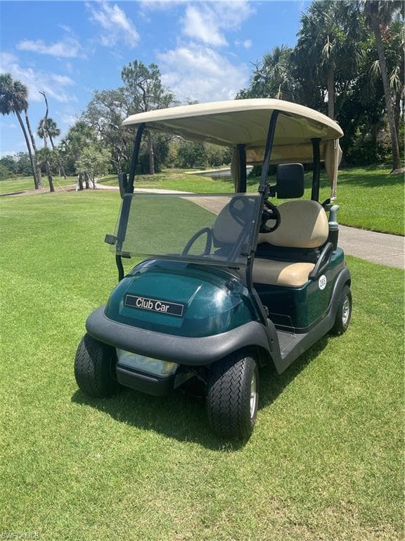 Club Car golf cart, golf cart garage and covered parking area included as well as a separate double door locked storage area!