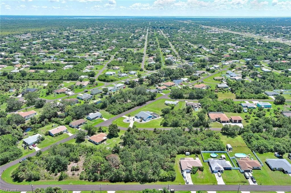 View of property location with nearby suburban area