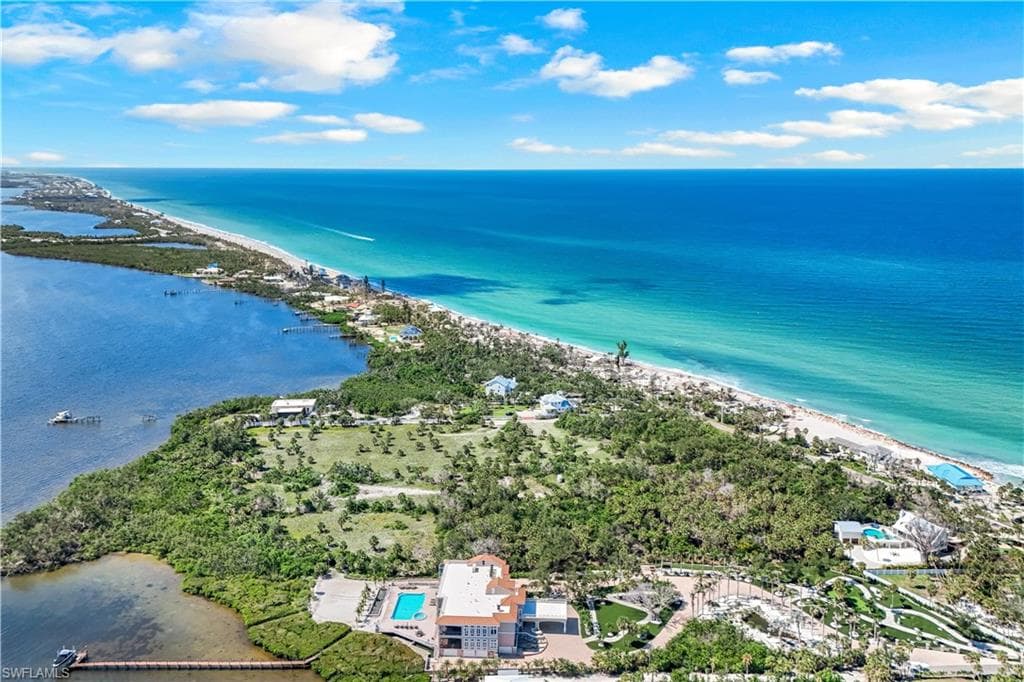 Aerial view of property and surrounding area featuring Lemon Bay on the left and the Gulf on the right