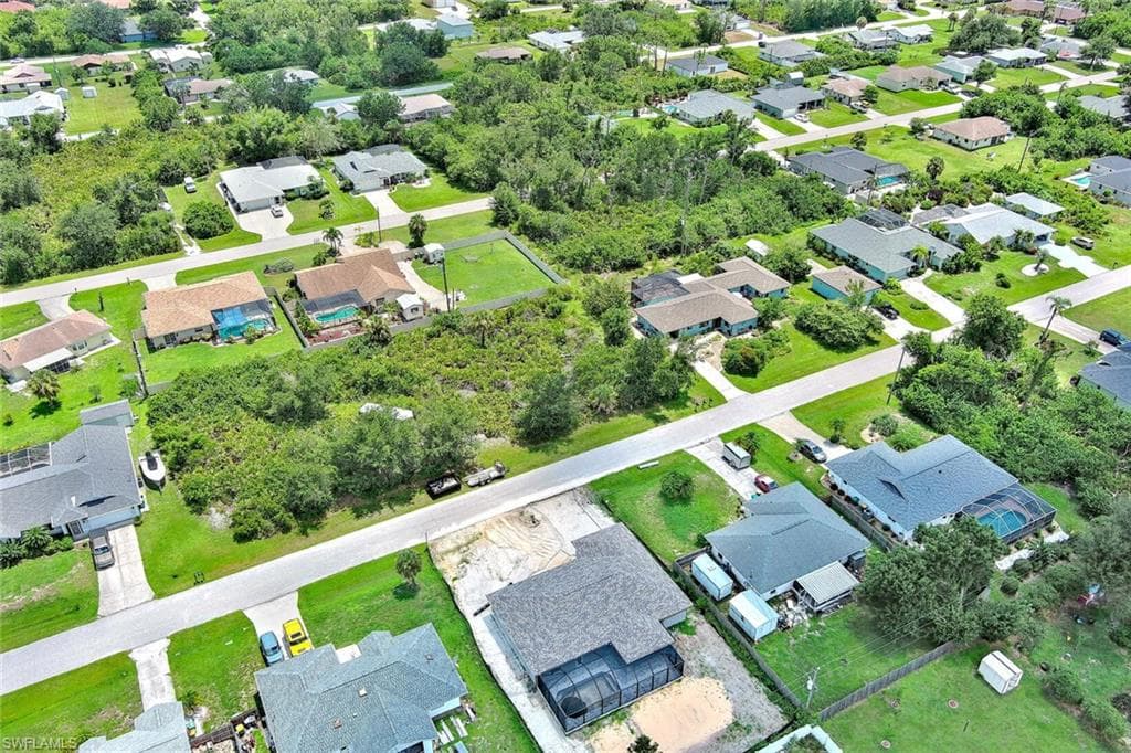 View of property location with nearby suburban area