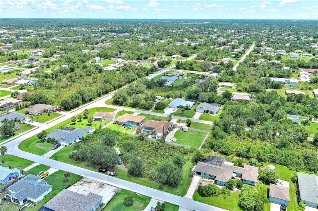 Aerial overview of property's location featuring nearby suburban area