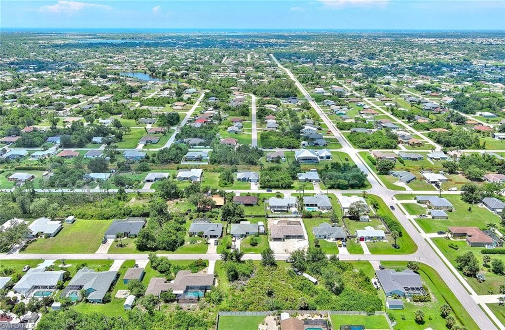 Aerial overview of property's location with nearby suburban area