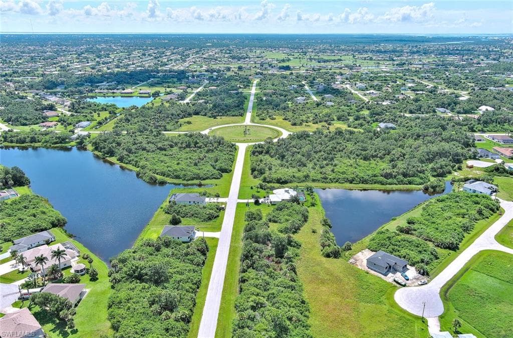 Aerial view of residential area with a large body of water