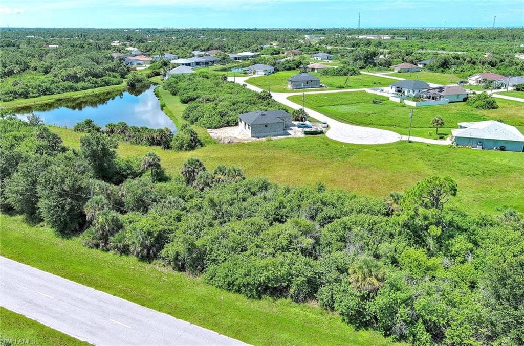Aerial view of residential area with a nearby body of water