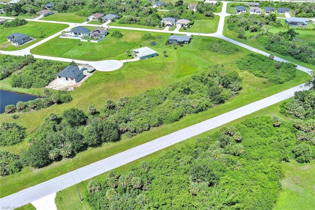 Aerial overview of property's location featuring a large body of water
