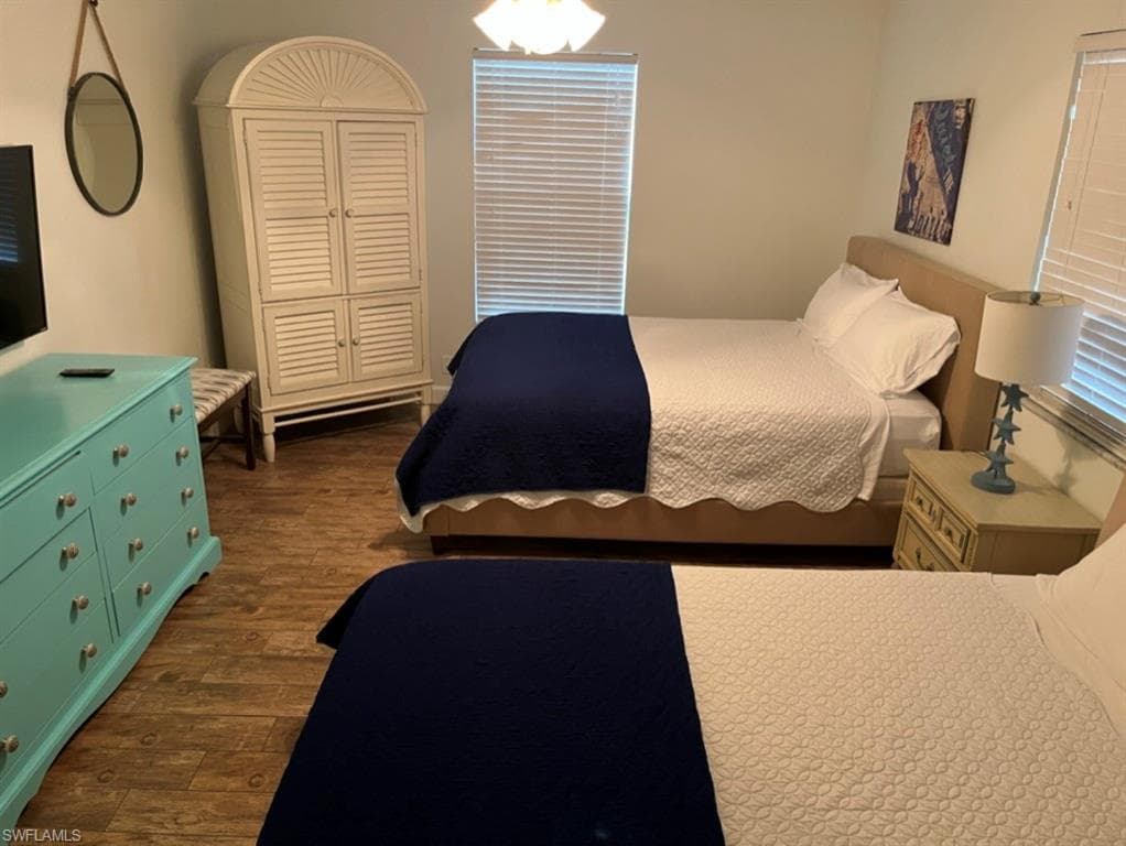 Bedroom featuring dark wood-style floors