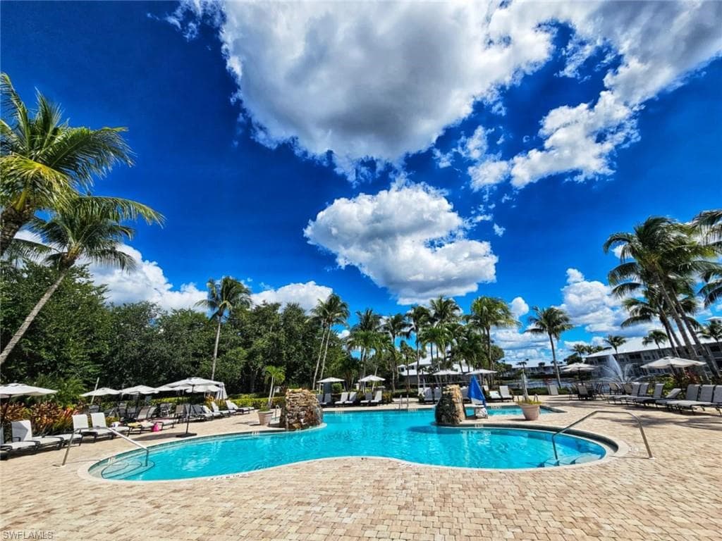 Community pool featuring a patio