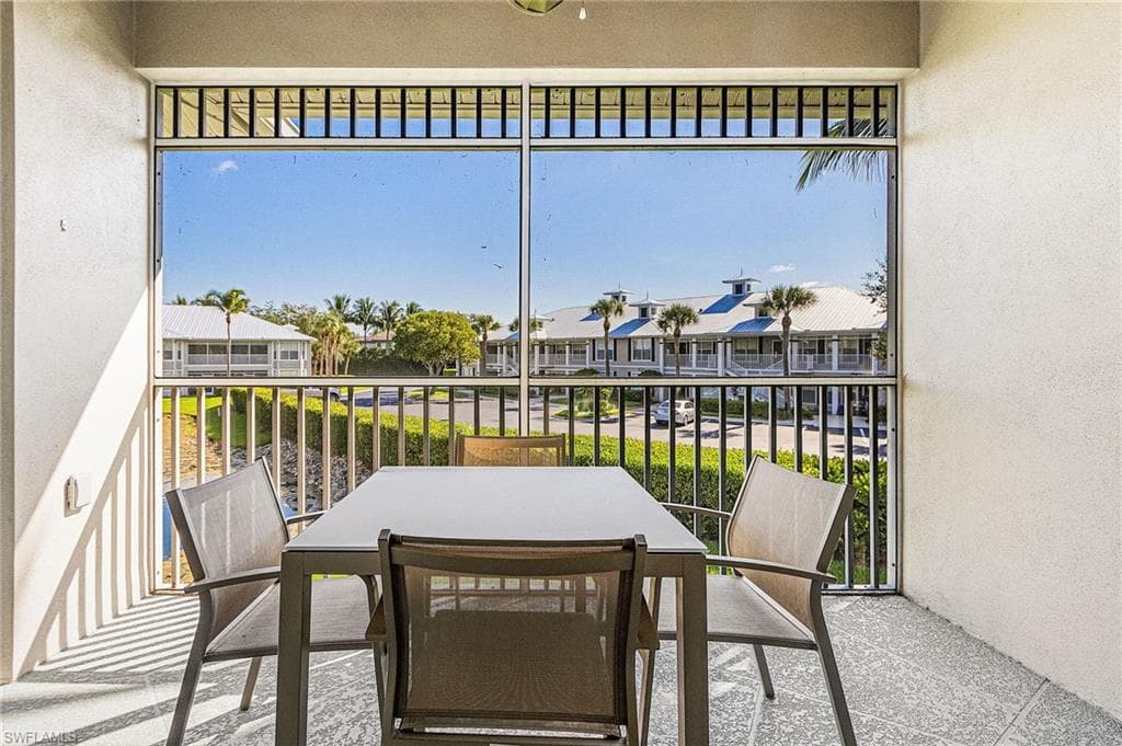 Virtual staged balcony with plenty of natural light and a residential view