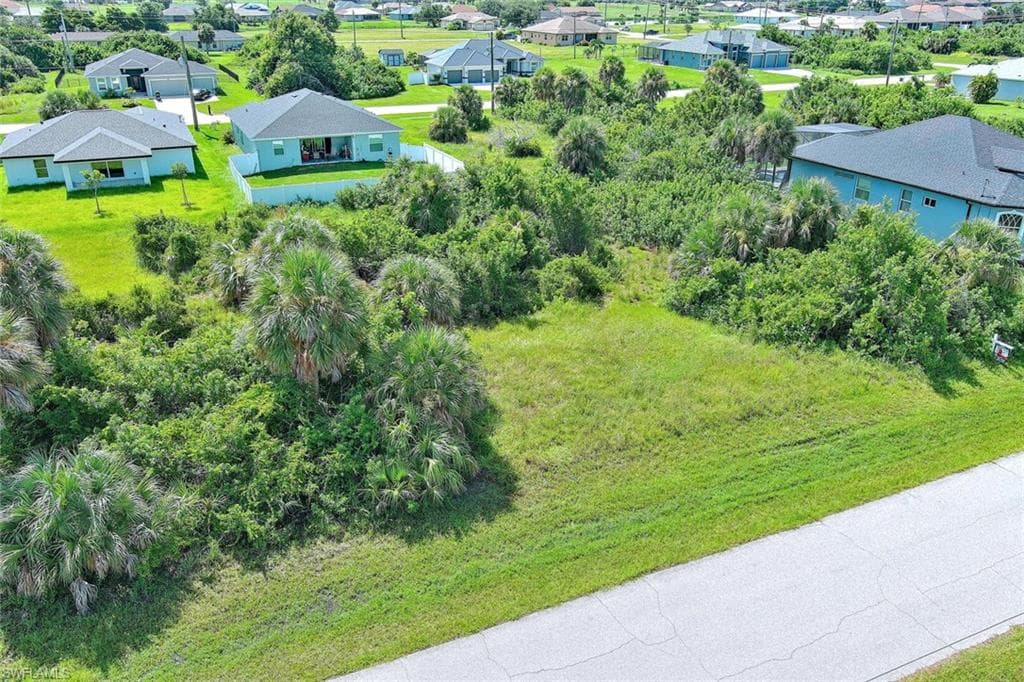 Aerial perspective of suburban area with a tree filled landscape