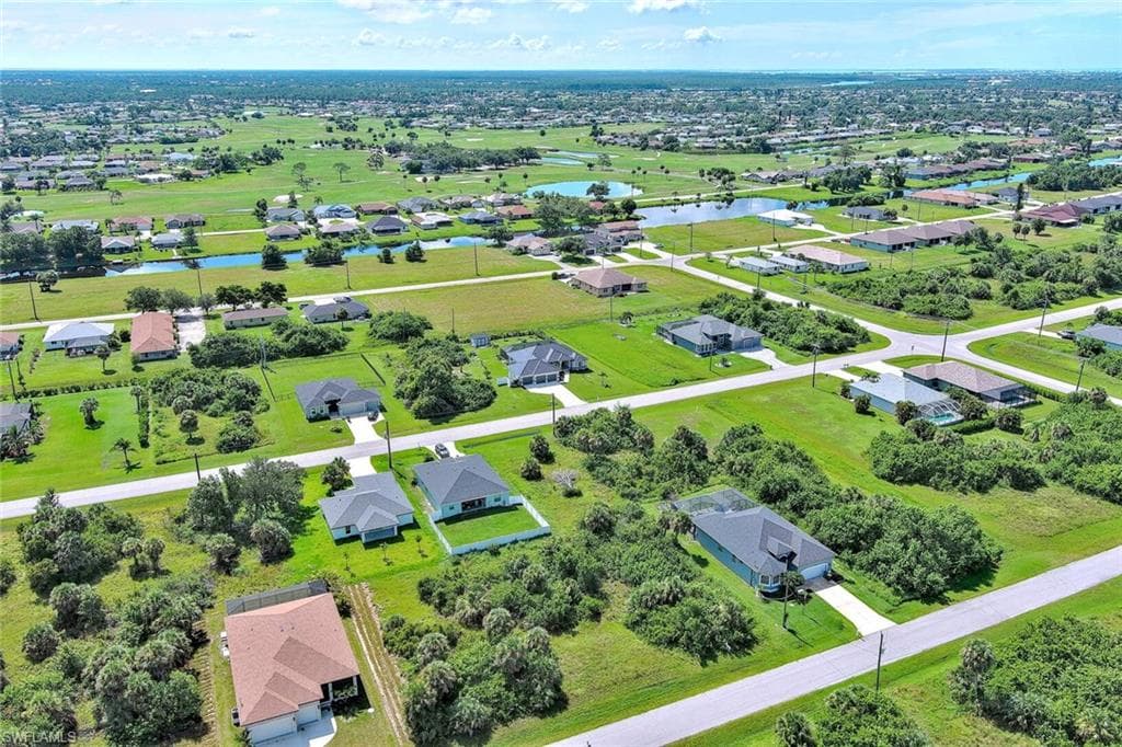 Aerial view of residential area with a nearby body of water