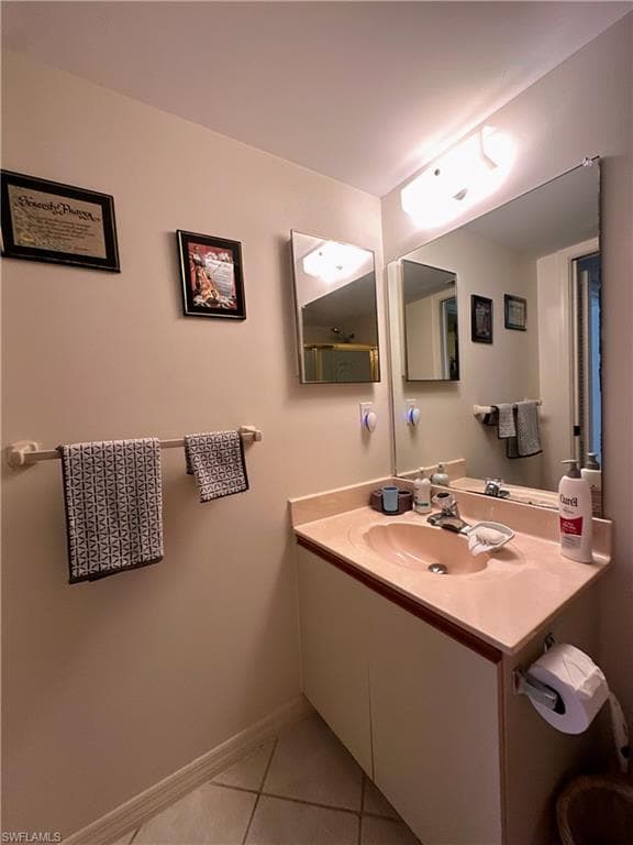 Bathroom featuring light tile patterned floors and vanity