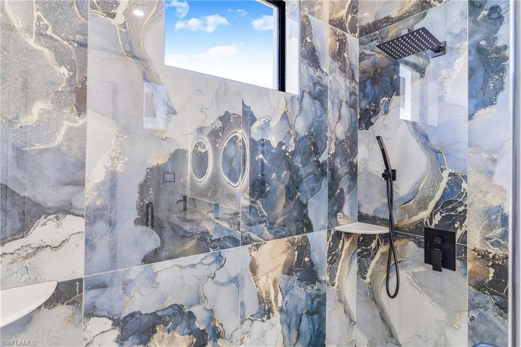 Bathroom view of a marble finish shower