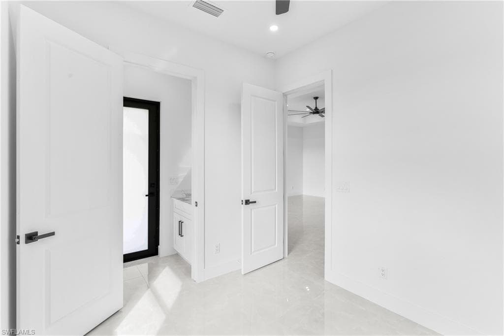 Unfurnished bedroom featuring ceiling fan, recessed lighting, and light tile patterned flooring