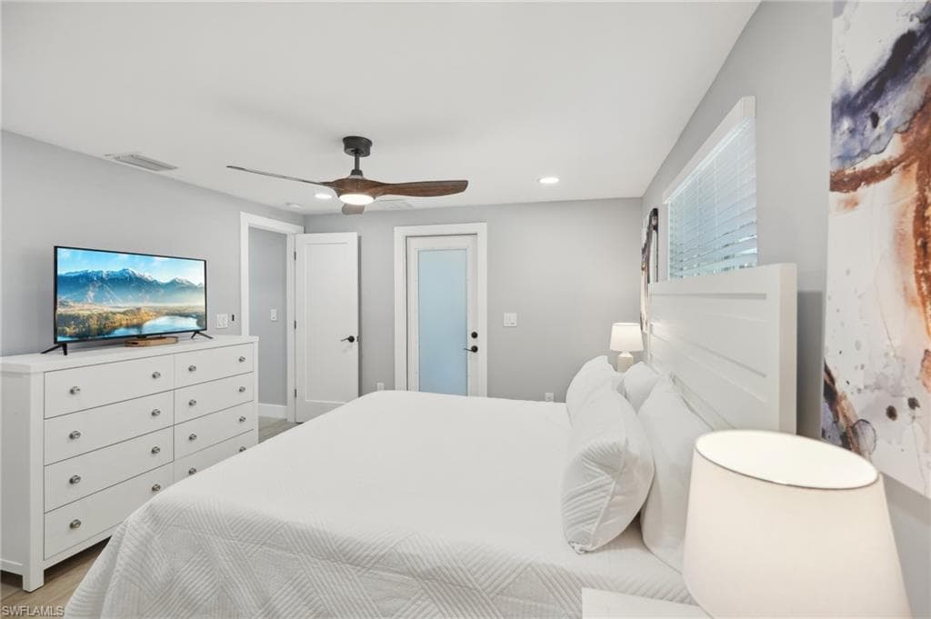 Bedroom with ceiling fan, recessed lighting, and light wood-style floors