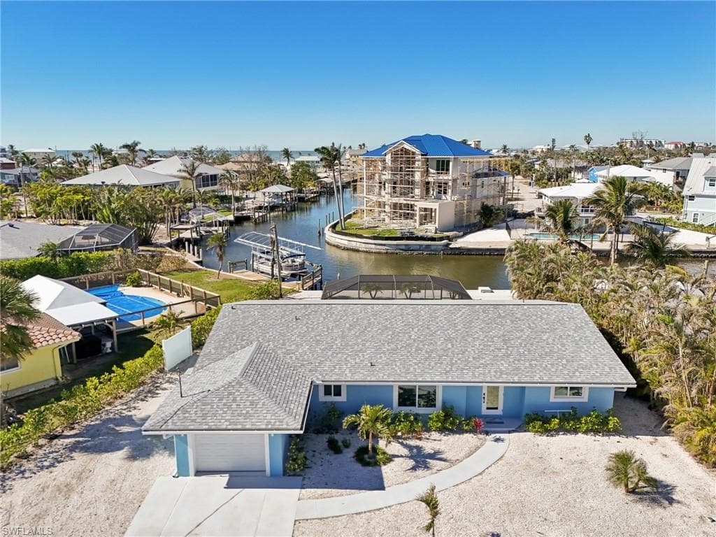 Aerial perspective of suburban area with a large body of water