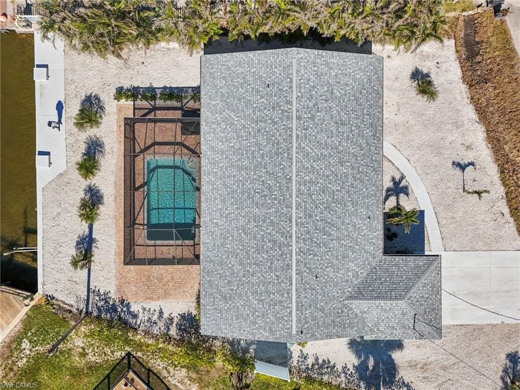 View of subject property featuring a pool area