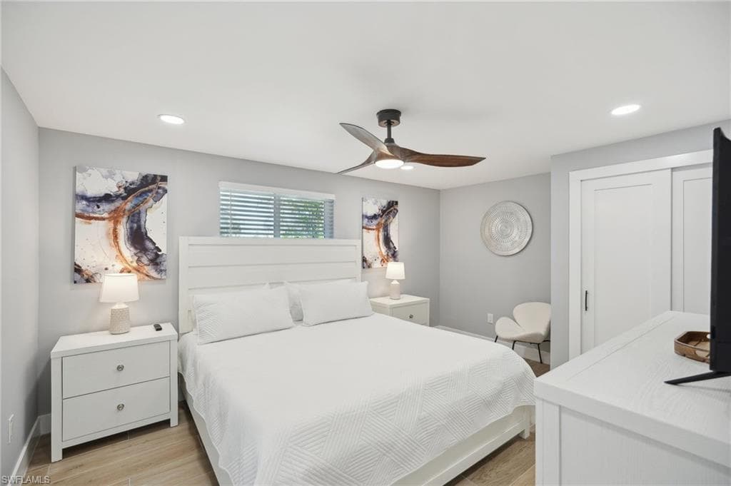 Bedroom featuring recessed lighting, light wood-type flooring, and a ceiling fan